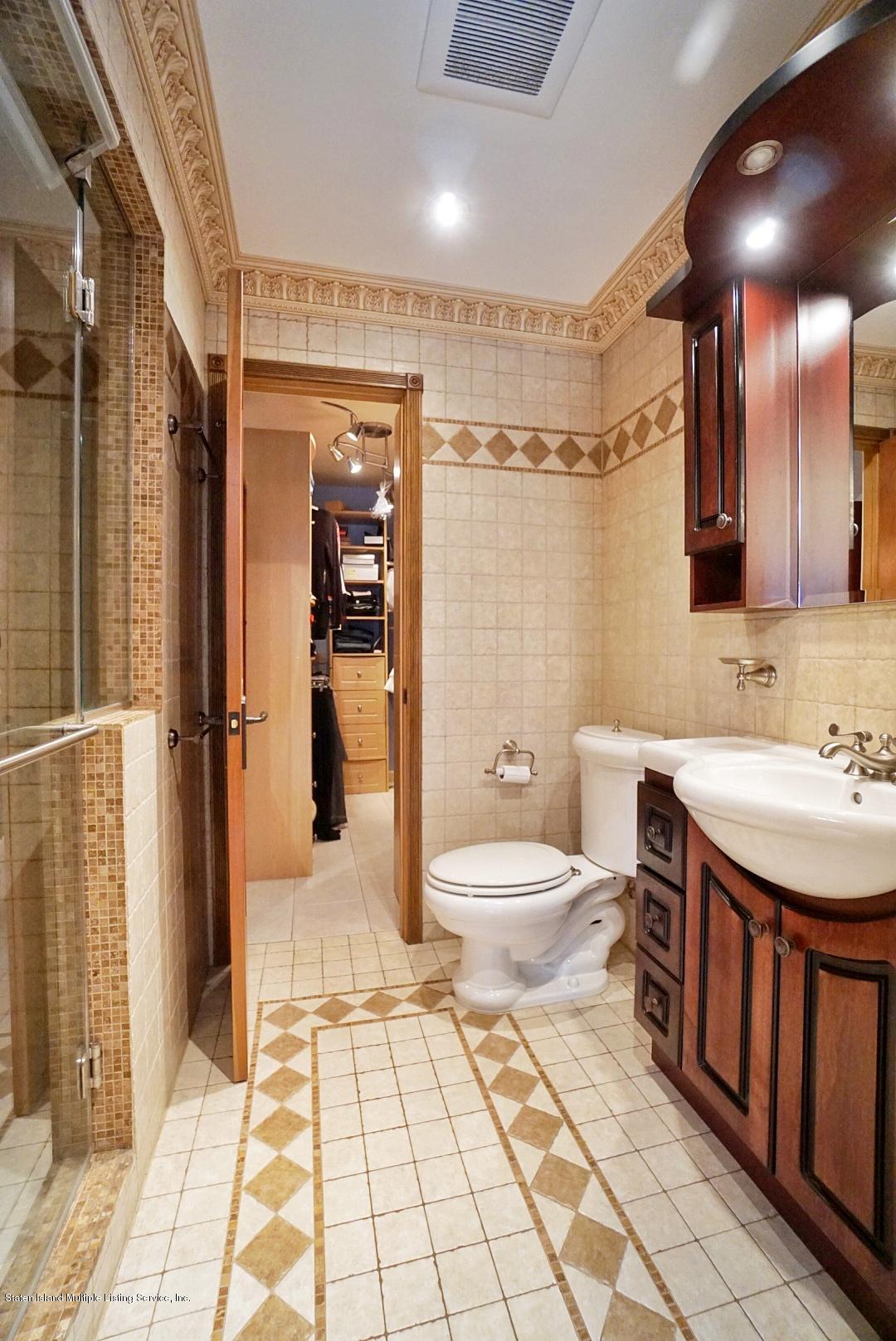 178 Admiralty Loop Staten Island, NY 10309 - Photo 29 of 50 a bathroom with a sink a toilet and shower