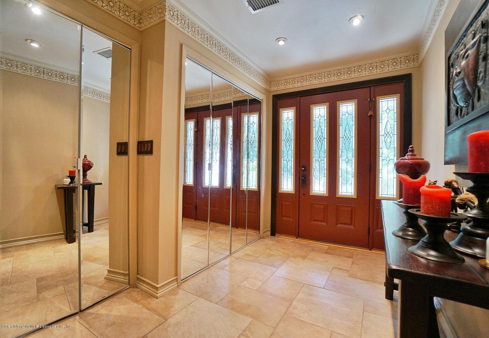 178 Admiralty Loop Staten Island, NY 10309 - Photo 3 of 50 a very nice looking room with a large mirror and glass door