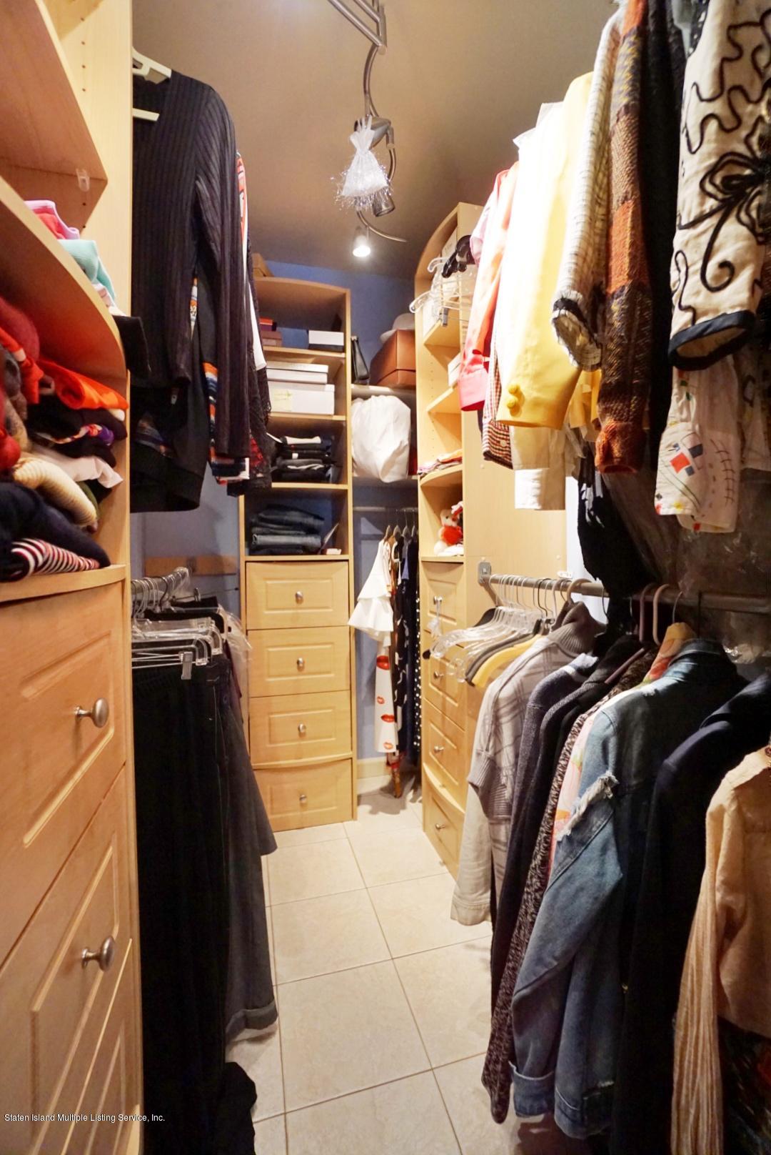 178 Admiralty Loop Staten Island, NY 10309 - Photo 31 of 50 a view of walk in closet with clothes and shoes
