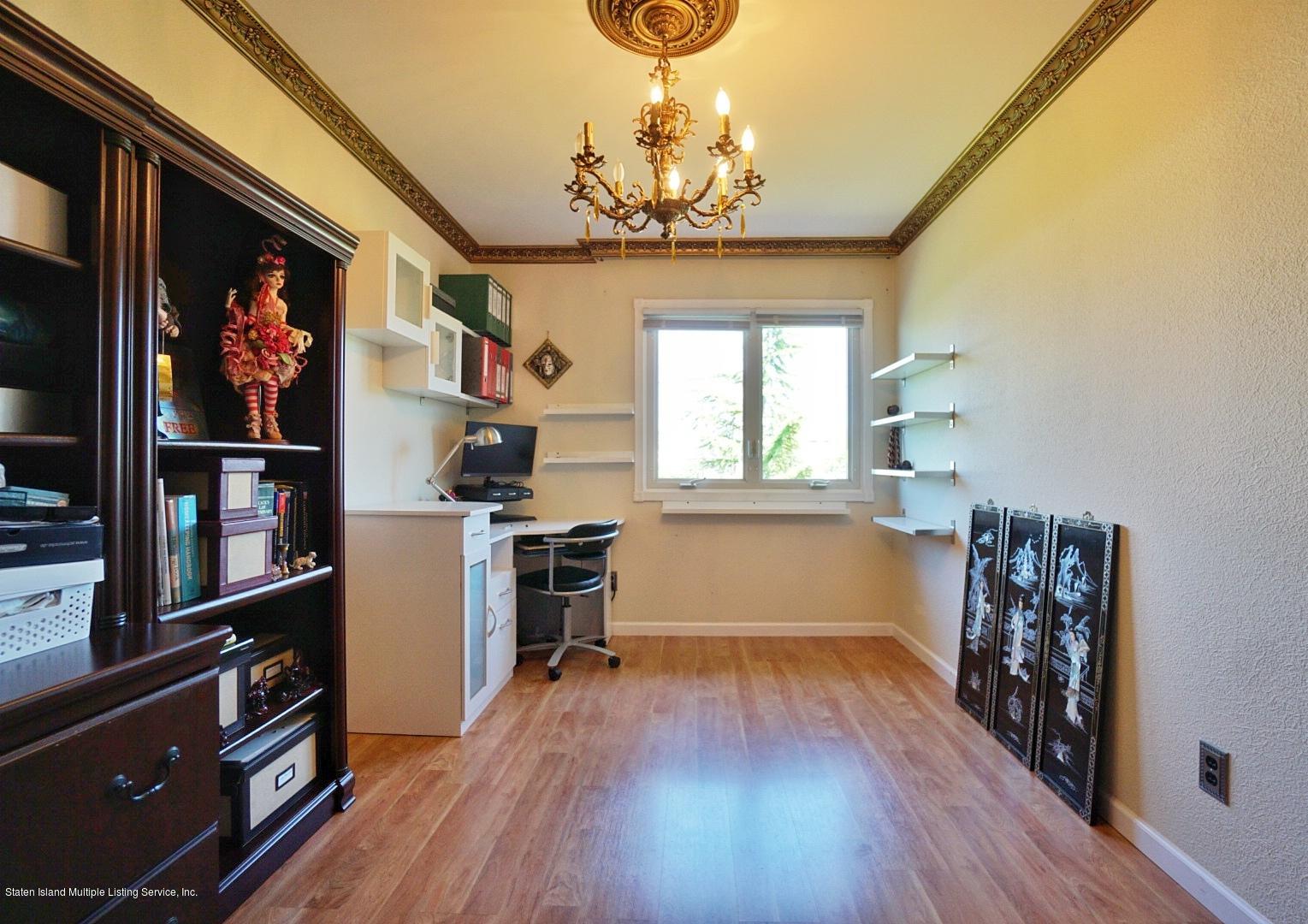178 Admiralty Loop Staten Island, NY 10309 - Photo 33 of 50 a view of a room with wooden floor and lots of windows