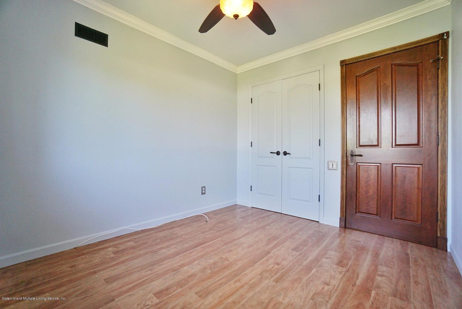 178 Admiralty Loop Staten Island, NY 10309 - Photo 34 of 50 wooden floor in an empty room