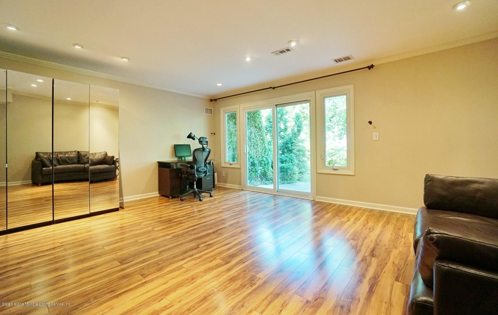 178 Admiralty Loop Staten Island, NY 10309 - Photo 8 of 50 a living room with furniture and large windows