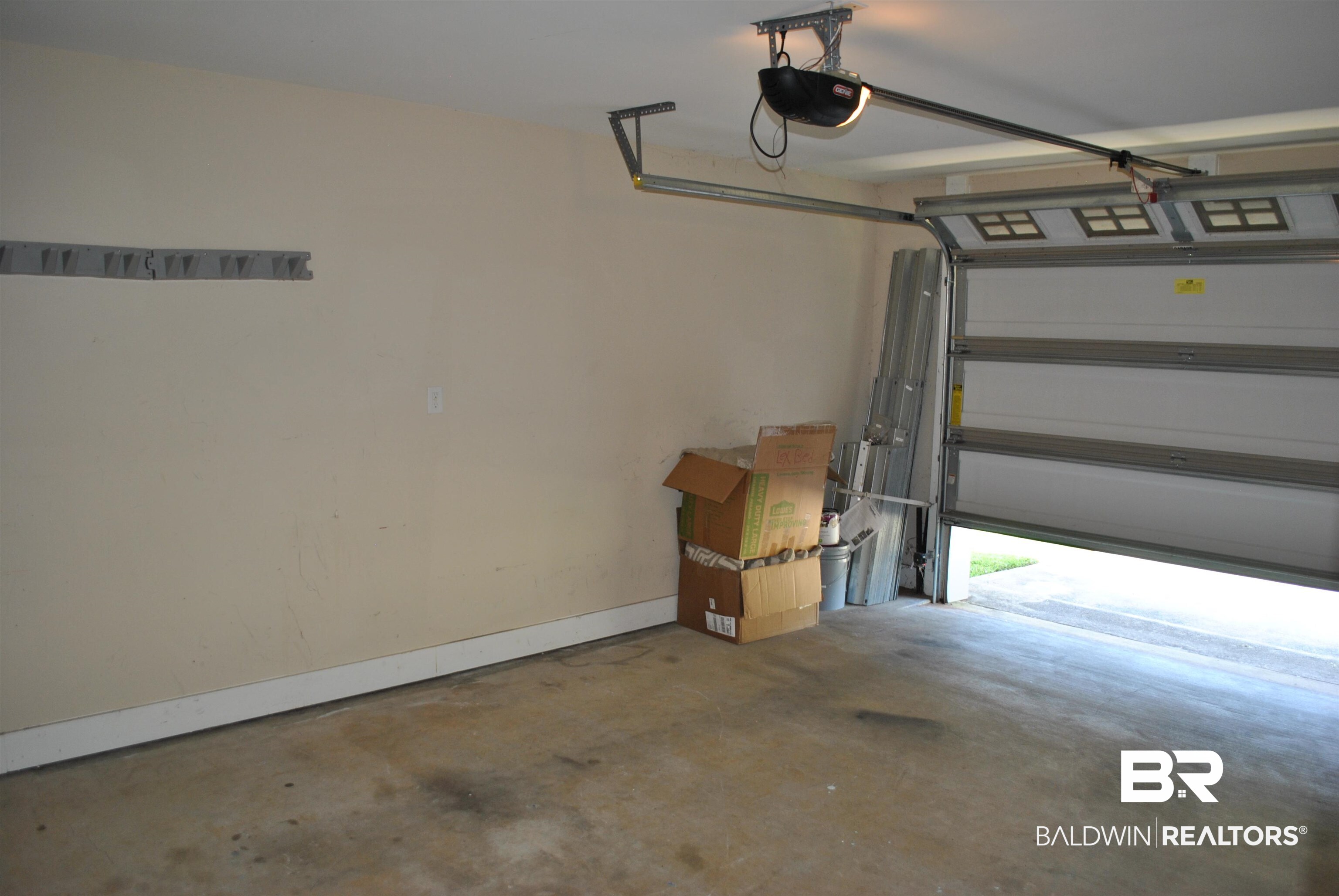 2161 Spring Grove West Mobile, AL 36695 - Photo 30 of 31 Garage featuring baseboards and a garage door opener