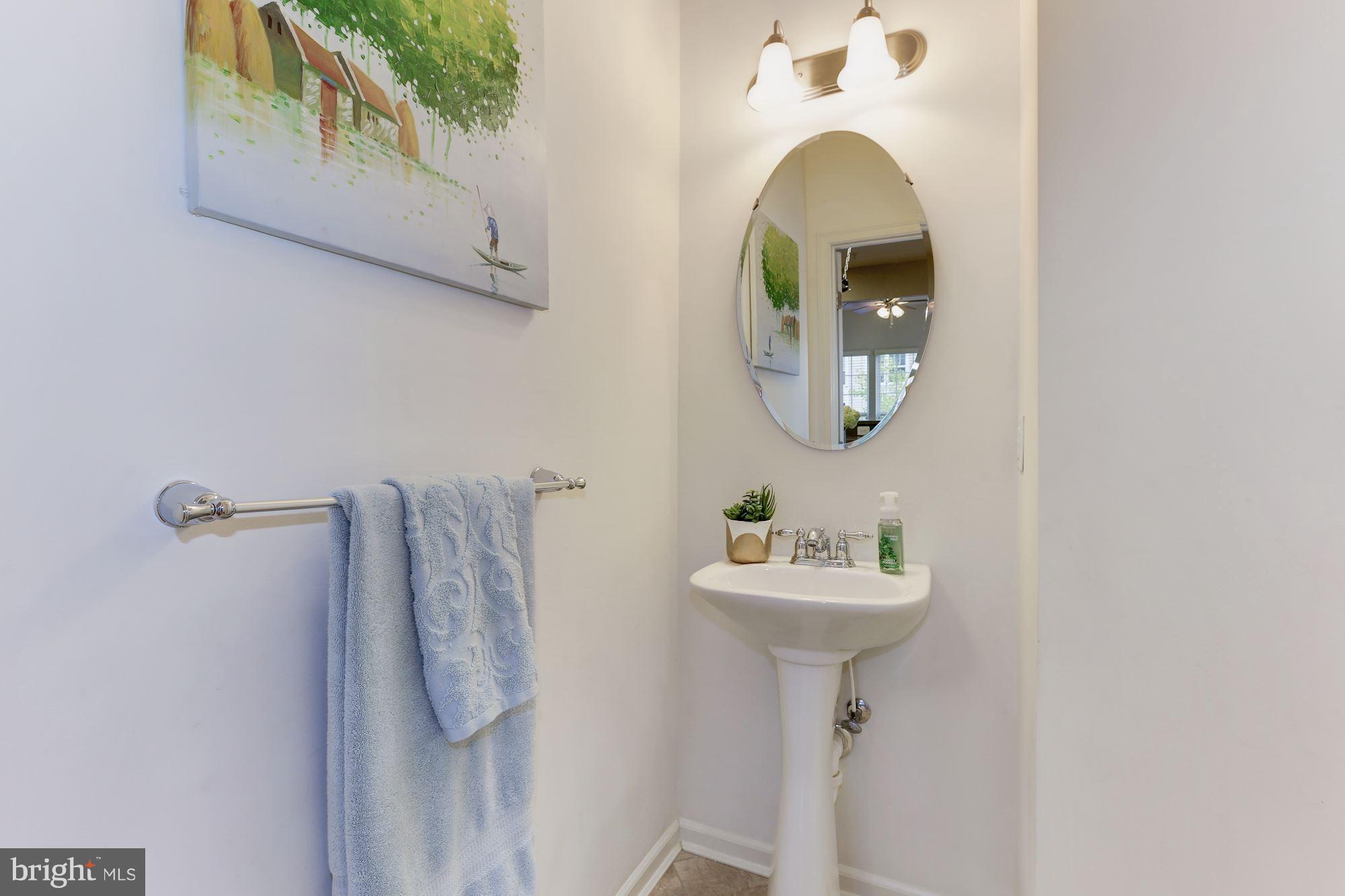 7522 Helston Court Hanover, MD 21076 - Photo 16 of 30 a bathroom with a sink and a mirror