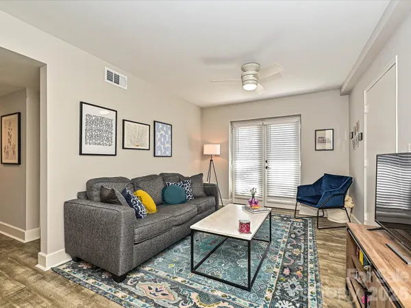 a living room with furniture and a window