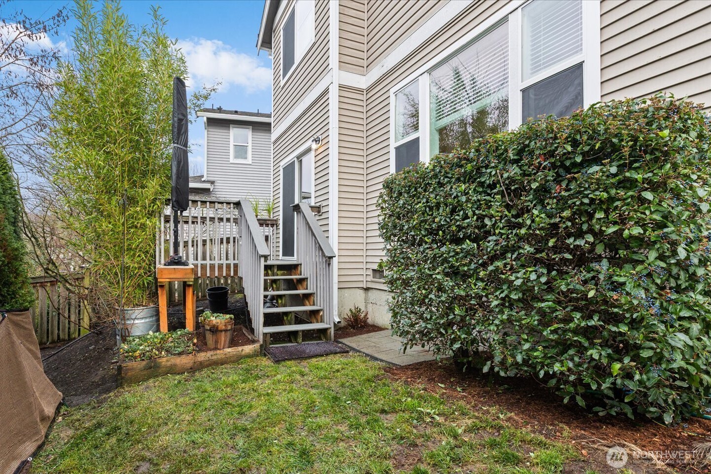 6011 29th Avenue Southwest Seattle, WA 98126 - Photo 22 of 29 a view of a house with a yard and sitting area
