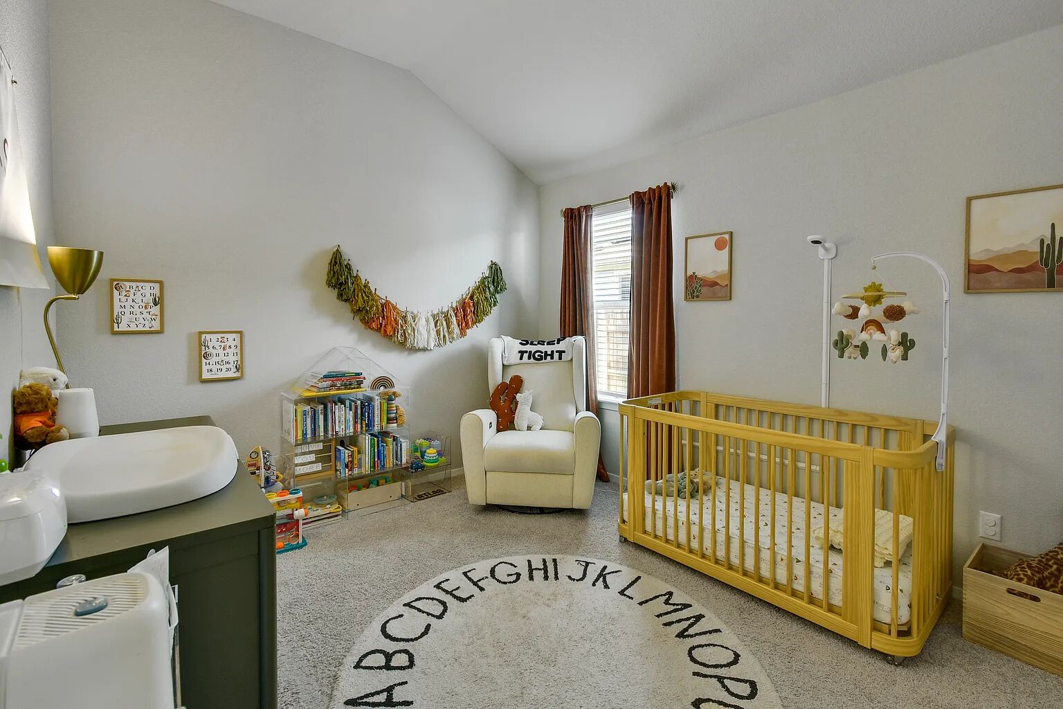 121 Crescent Street Georgetown, TX 78626 - Photo 14 of 27 Bedroom with a nursery area, carpet flooring, and lofted ceiling