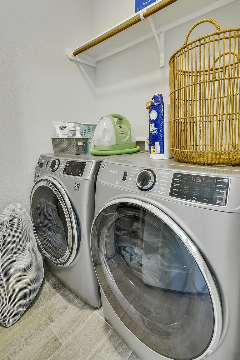 121 Crescent Street Georgetown, TX 78626 - Photo 16 of 27 Laundry room with washer and clothes dryer