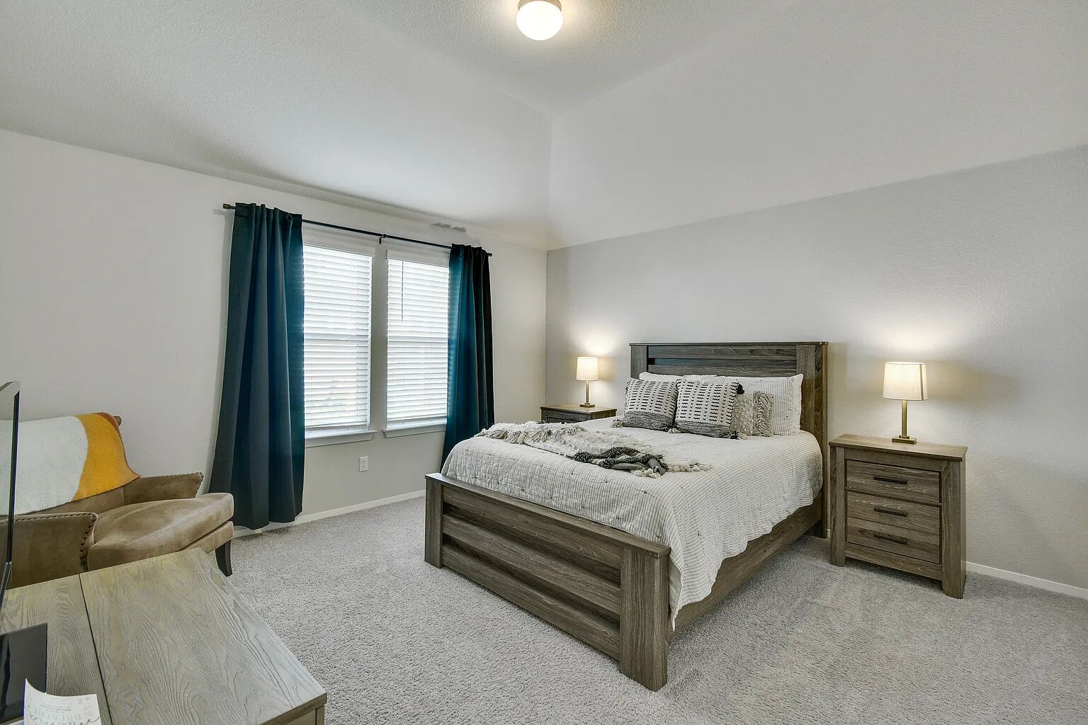 121 Crescent Street Georgetown, TX 78626 - Photo 17 of 27 Bedroom with light carpet and vaulted ceiling