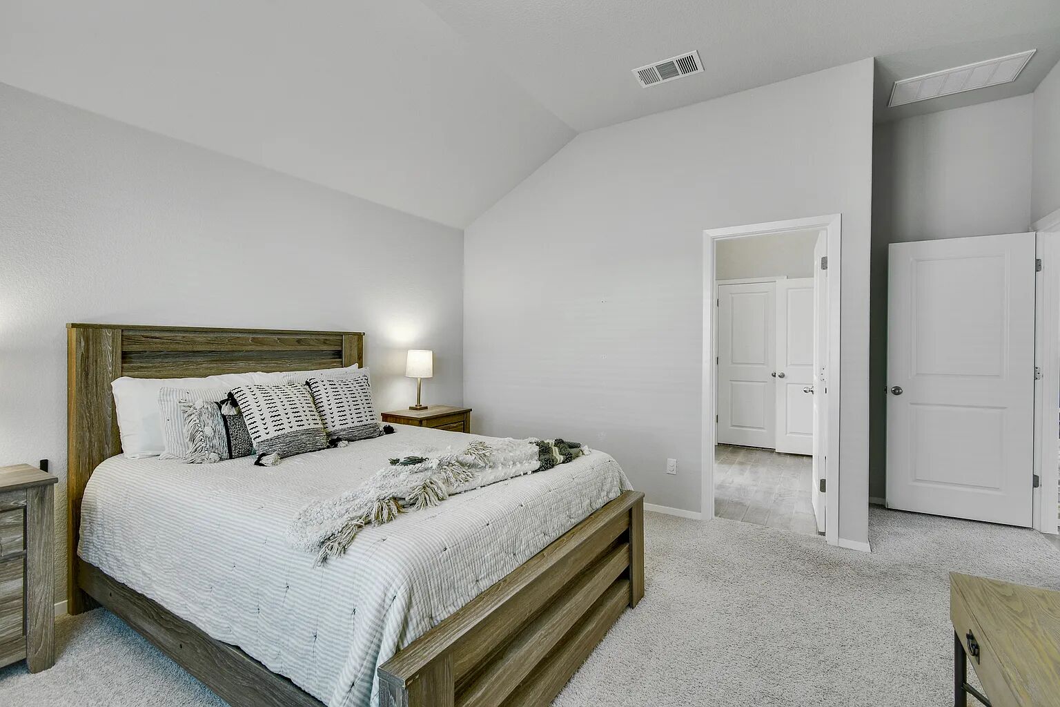 121 Crescent Street Georgetown, TX 78626 - Photo 18 of 27 Bedroom featuring lofted ceiling and light carpet