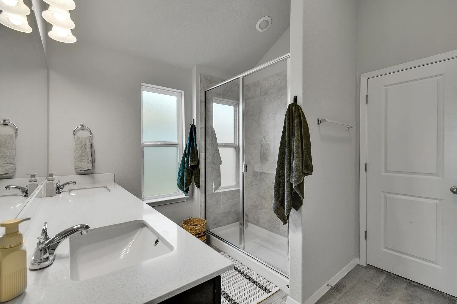 121 Crescent Street Georgetown, TX 78626 - Photo 20 of 27 Full bathroom with double vanity, a stall shower, and light wood-style flooring