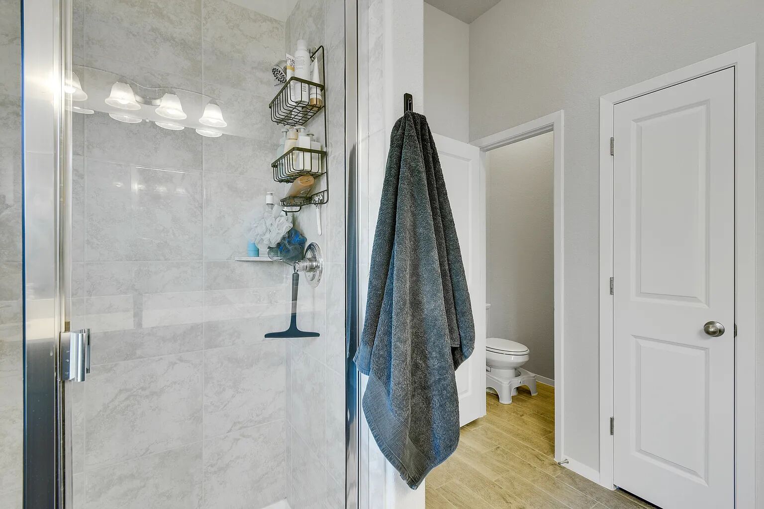 121 Crescent Street Georgetown, TX 78626 - Photo 21 of 27 Bathroom featuring a stall shower and light wood finished floors