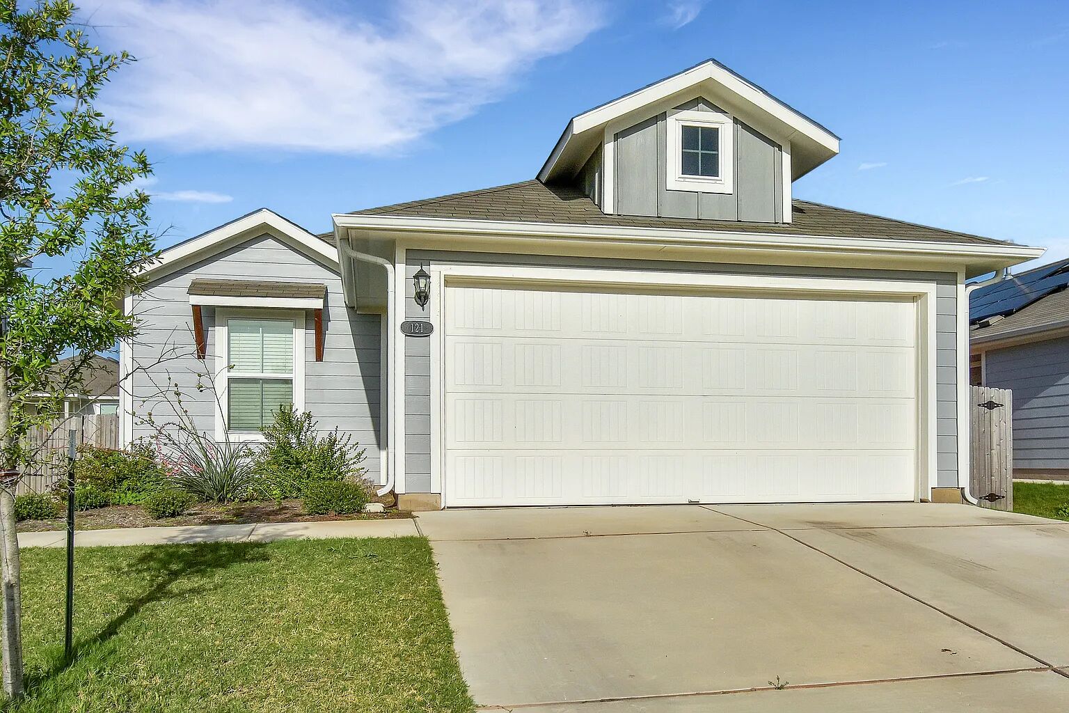 121 Crescent Street Georgetown, TX 78626 - Photo 3 of 27 View of front of property with driveway, a shingled roof, a front lawn, and an attached garage