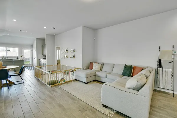 a living room with furniture and a large window