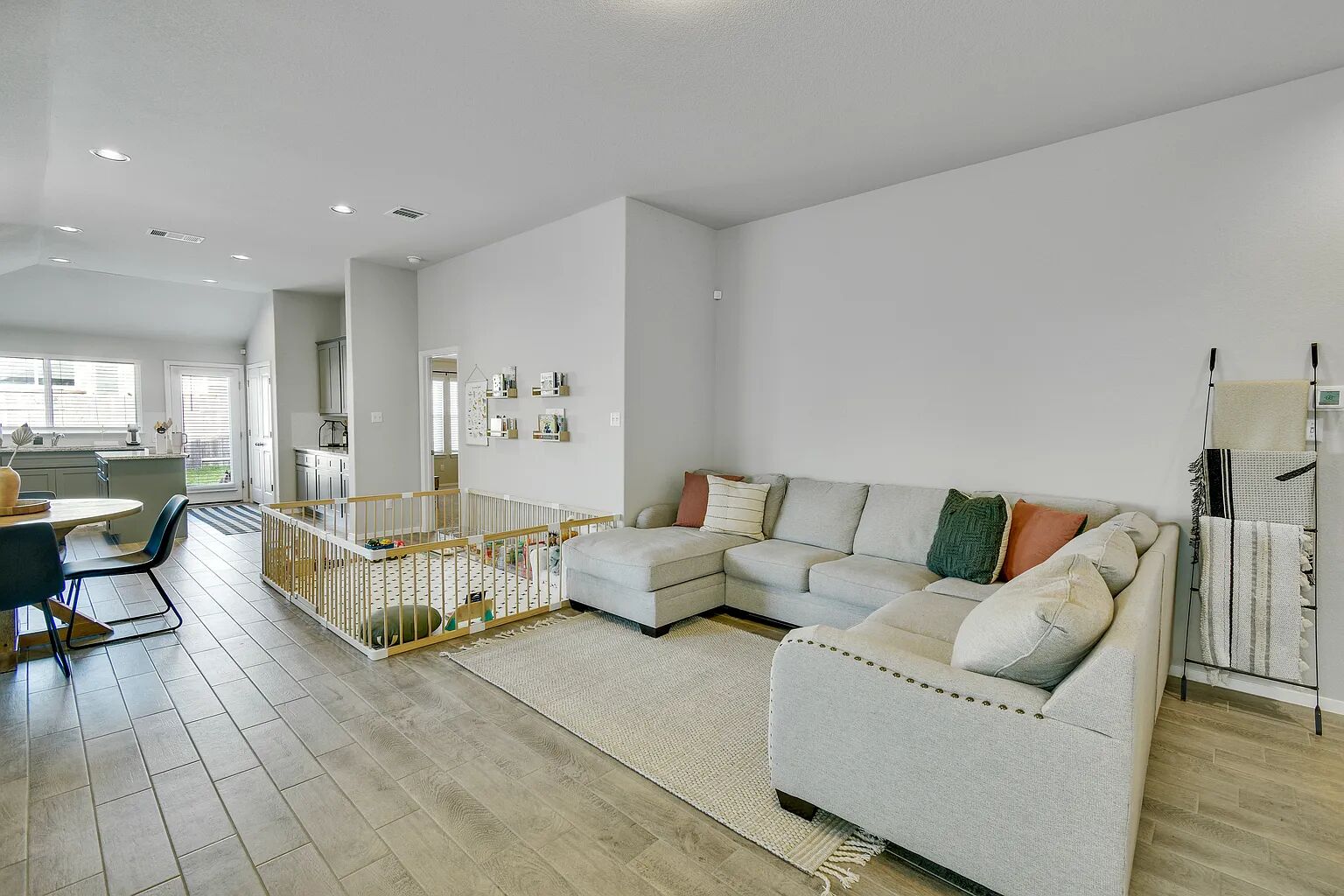 121 Crescent Street Georgetown, TX 78626 - Photo 5 of 27 Living area featuring light wood finished floors, lofted ceiling, and recessed lighting