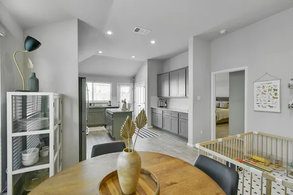 a living room with furniture fireplace and a table