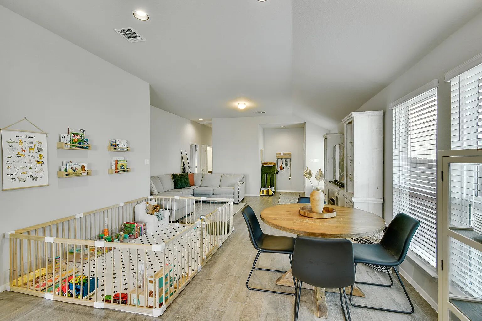 121 Crescent Street Georgetown, TX 78626 - Photo 9 of 27 Dining area with light wood-style flooring and vaulted ceiling