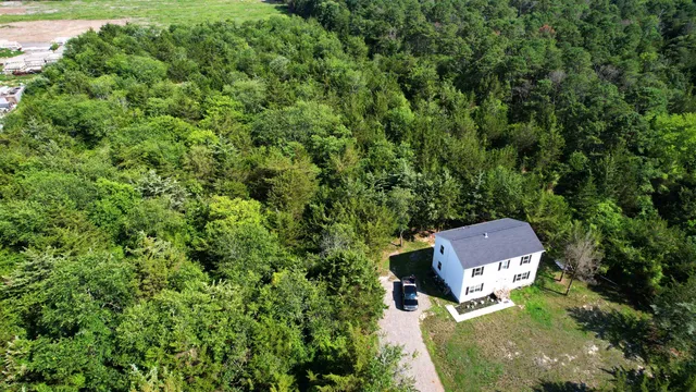 an aerial view of house with yard