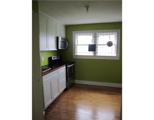 1021 Comanche Street Corpus Christi, TX 78401 - Photo 3 of 5 a kitchen with a window and a sink