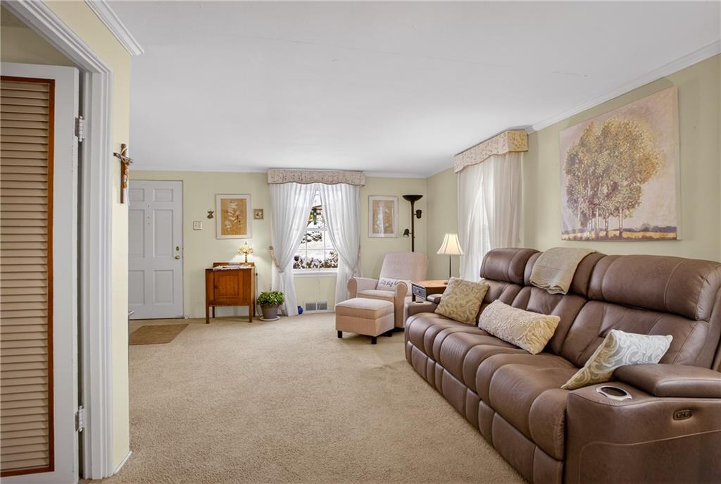 4241 Greenridge Road Pittsburgh, PA 15234 - Photo 11 of 50 a living room with furniture and a window
