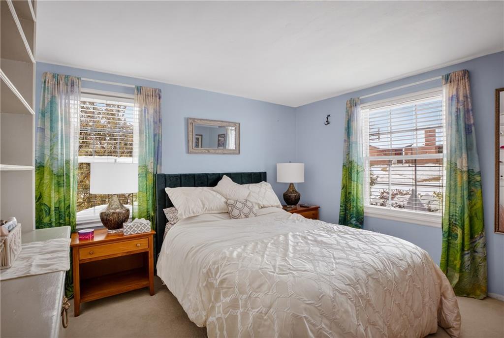 4241 Greenridge Road Pittsburgh, PA 15234 - Photo 19 of 50 a spacious bedroom with a bed and a window