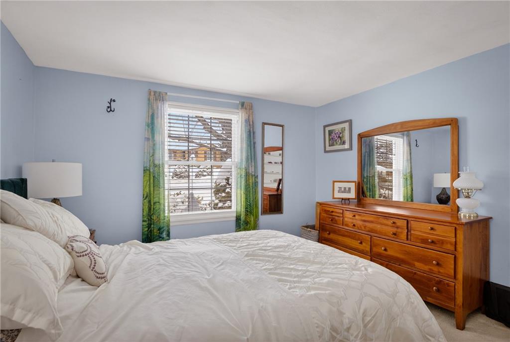 4241 Greenridge Road Pittsburgh, PA 15234 - Photo 22 of 50 a bedroom with a large bed and a dresser