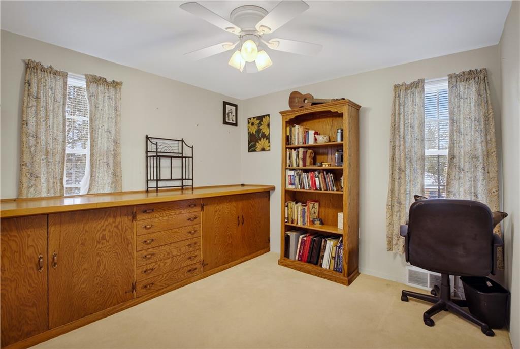 4241 Greenridge Road Pittsburgh, PA 15234 - Photo 23 of 50 a view of a workspace with furniture and a window