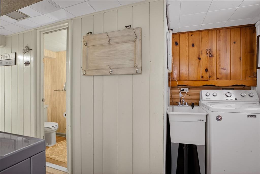 4241 Greenridge Road Pittsburgh, PA 15234 - Photo 33 of 50 a view of a hallway with washer and dryer