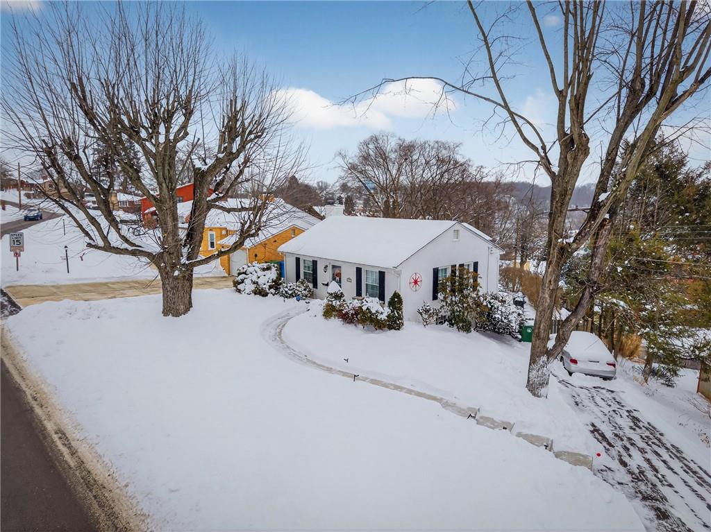 4241 Greenridge Road Pittsburgh, PA 15234 - Photo 39 of 50 a view of a house with a yard covered in snow