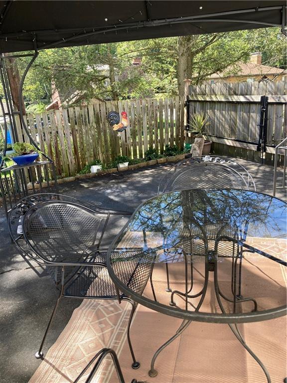 4241 Greenridge Road Pittsburgh, PA 15234 - Photo 40 of 50 a view of a porch with chairs and backyard