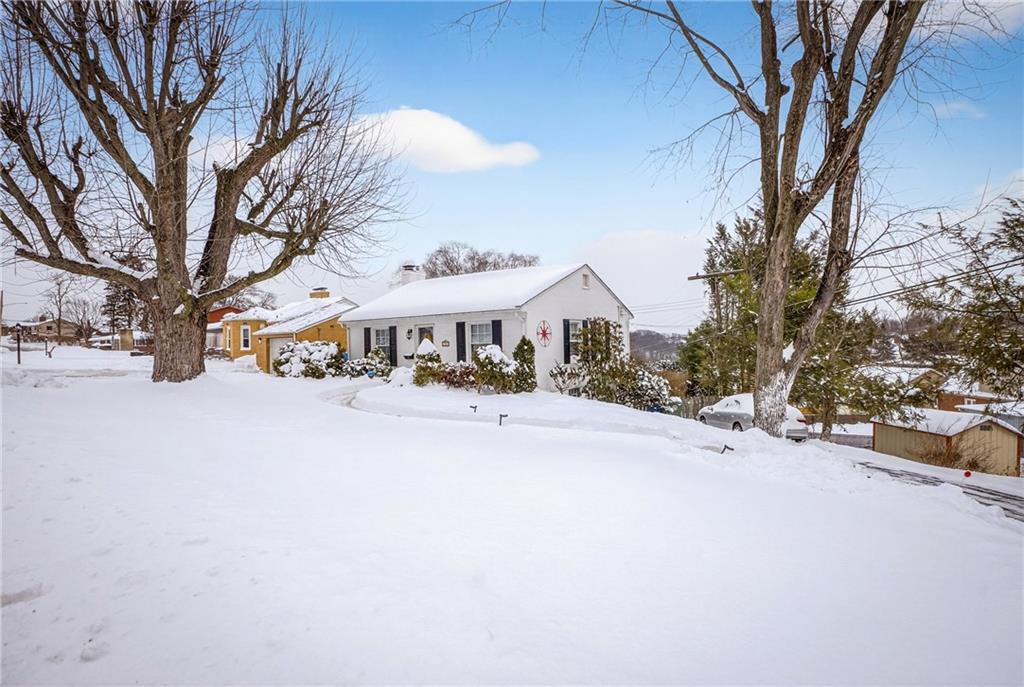 4241 Greenridge Road Pittsburgh, PA 15234 - Photo 4 of 50 a view of a street with houses