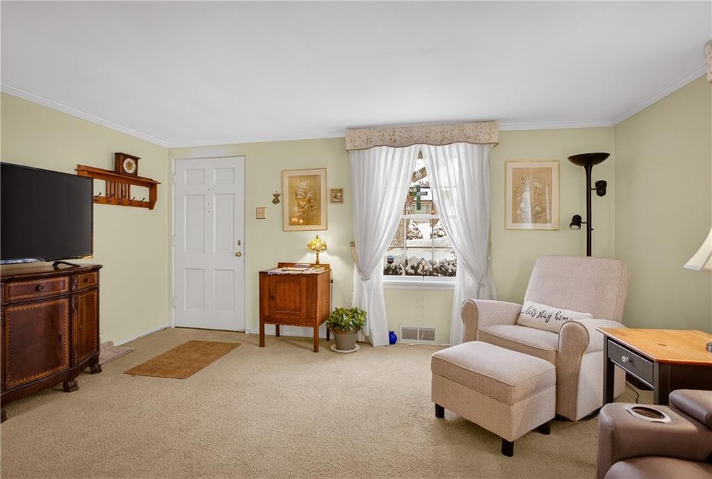 4241 Greenridge Road Pittsburgh, PA 15234 - Photo 6 of 50 a living room with furniture and a flat screen tv