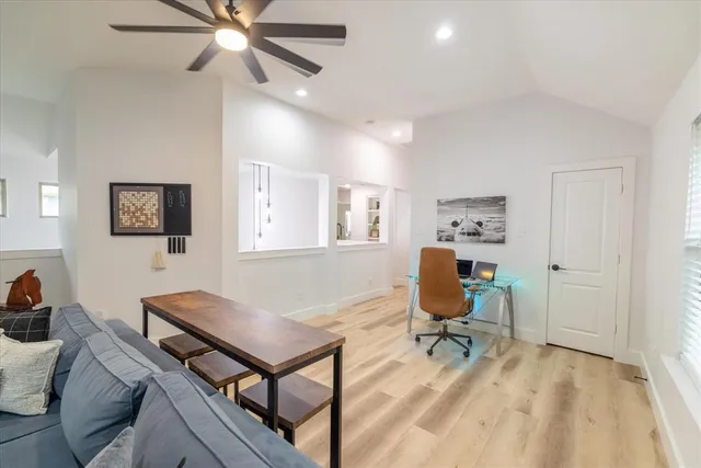 a bathroom with a sink vanity granite toilet and shower