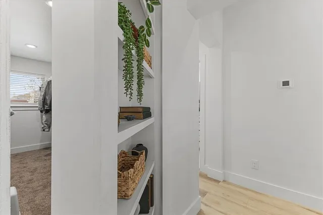 a view of a patio with table and chairs and potted plants