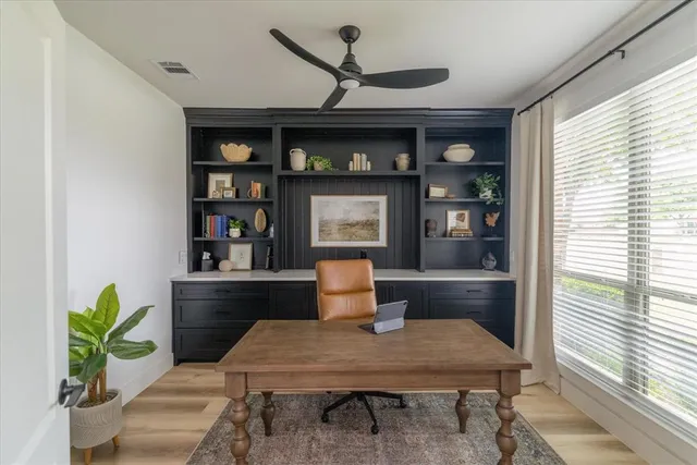 a workspace with furniture and wooden floor