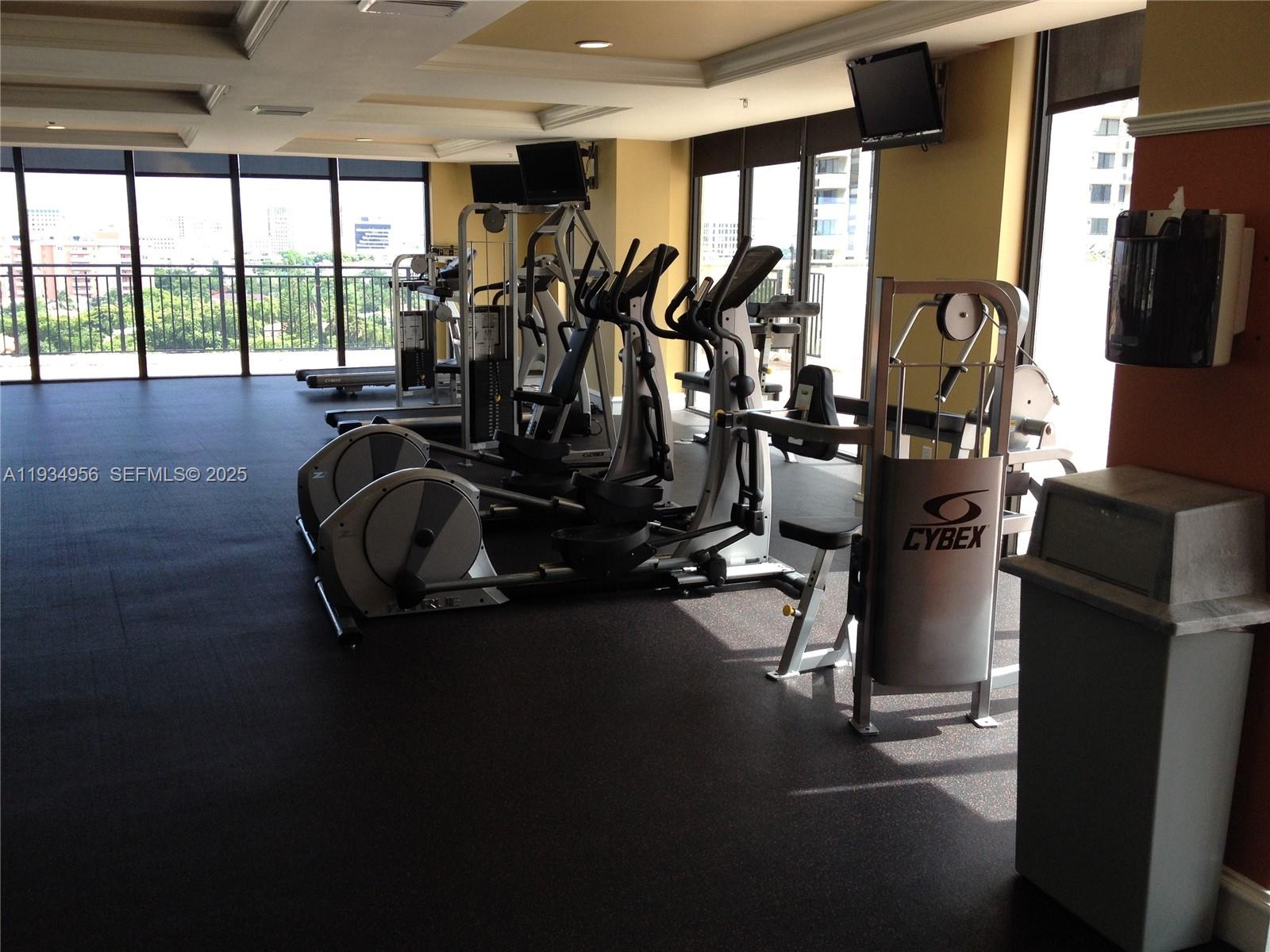 888 Douglas Road, Unit PH04 Coral Gables, FL 33134 - Photo 12 of 15 Well Equipped Gym Faces Rooftop Pool & View of Coral Gables