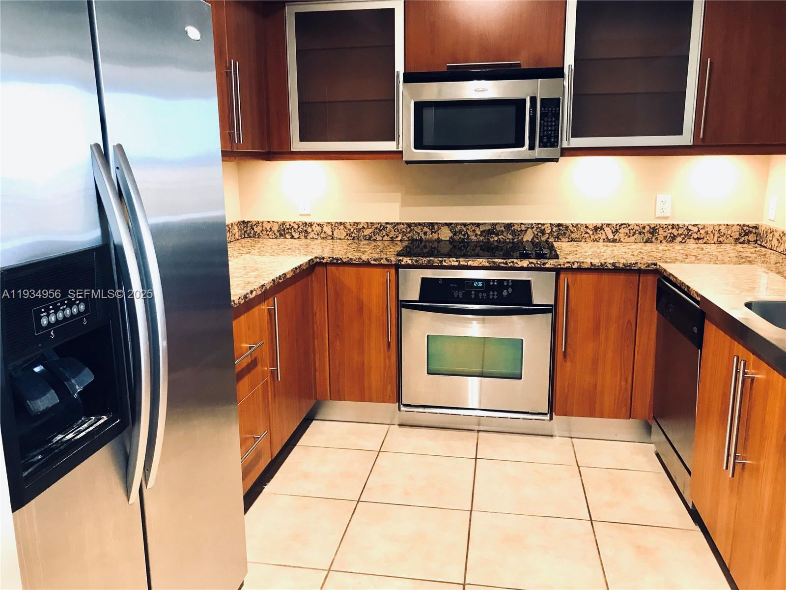 888 Douglas Road, Unit PH04 Coral Gables, FL 33134 - Photo 4 of 15 U-Shaped Kitchen at Entry