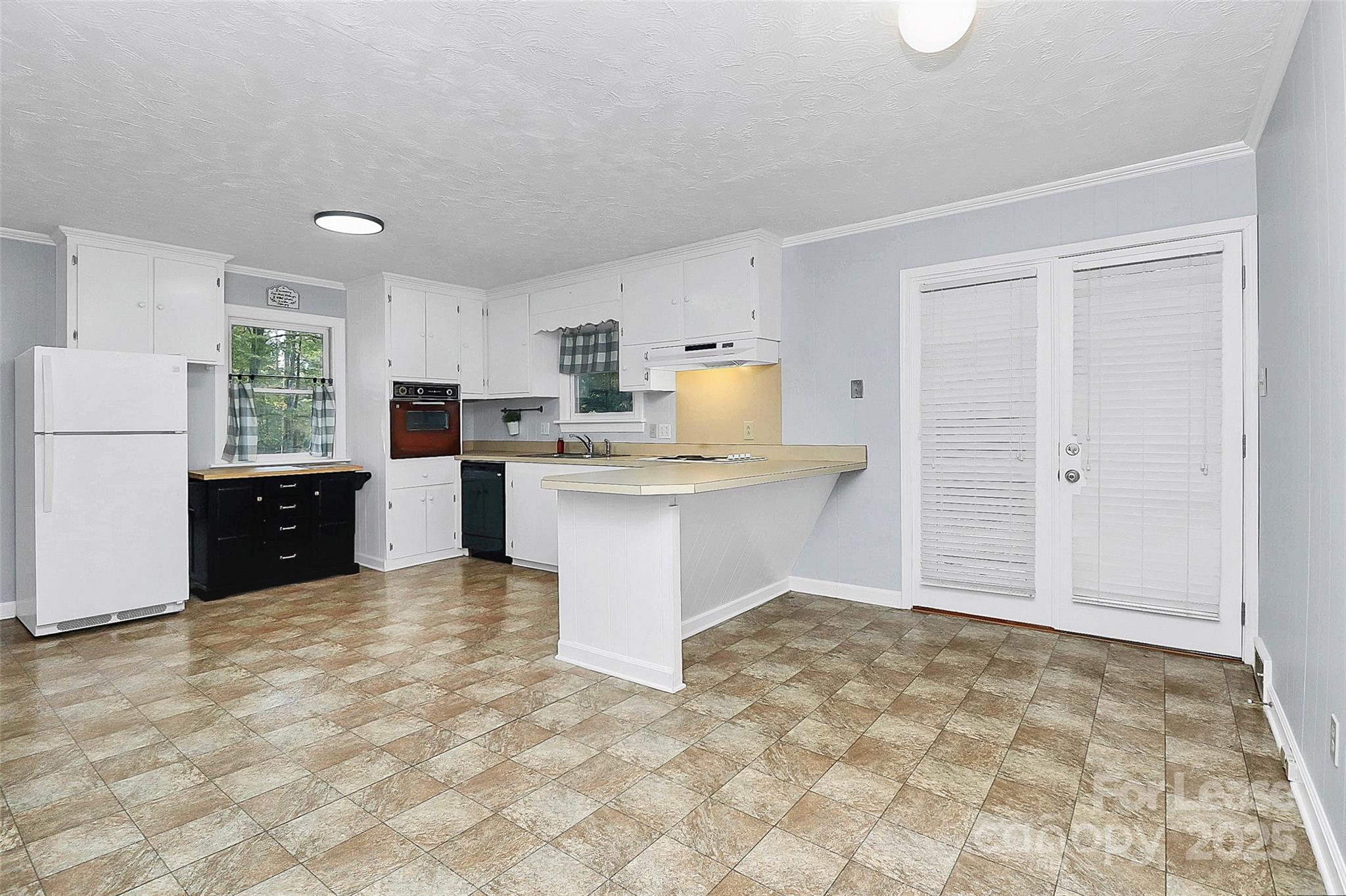 3685 Old Salisbury-Concord Road Concord, NC 28025 - Photo 11 of 33 a kitchen with a cabinets and appliances