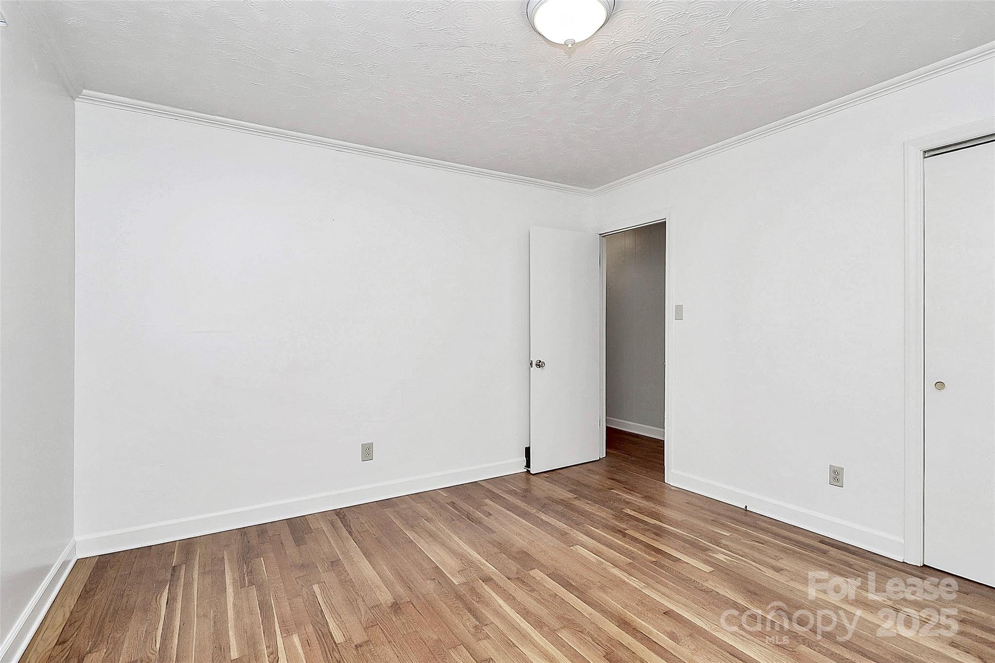 3685 Old Salisbury-Concord Road Concord, NC 28025 - Photo 19 of 33 a view of an empty room with wooden floor