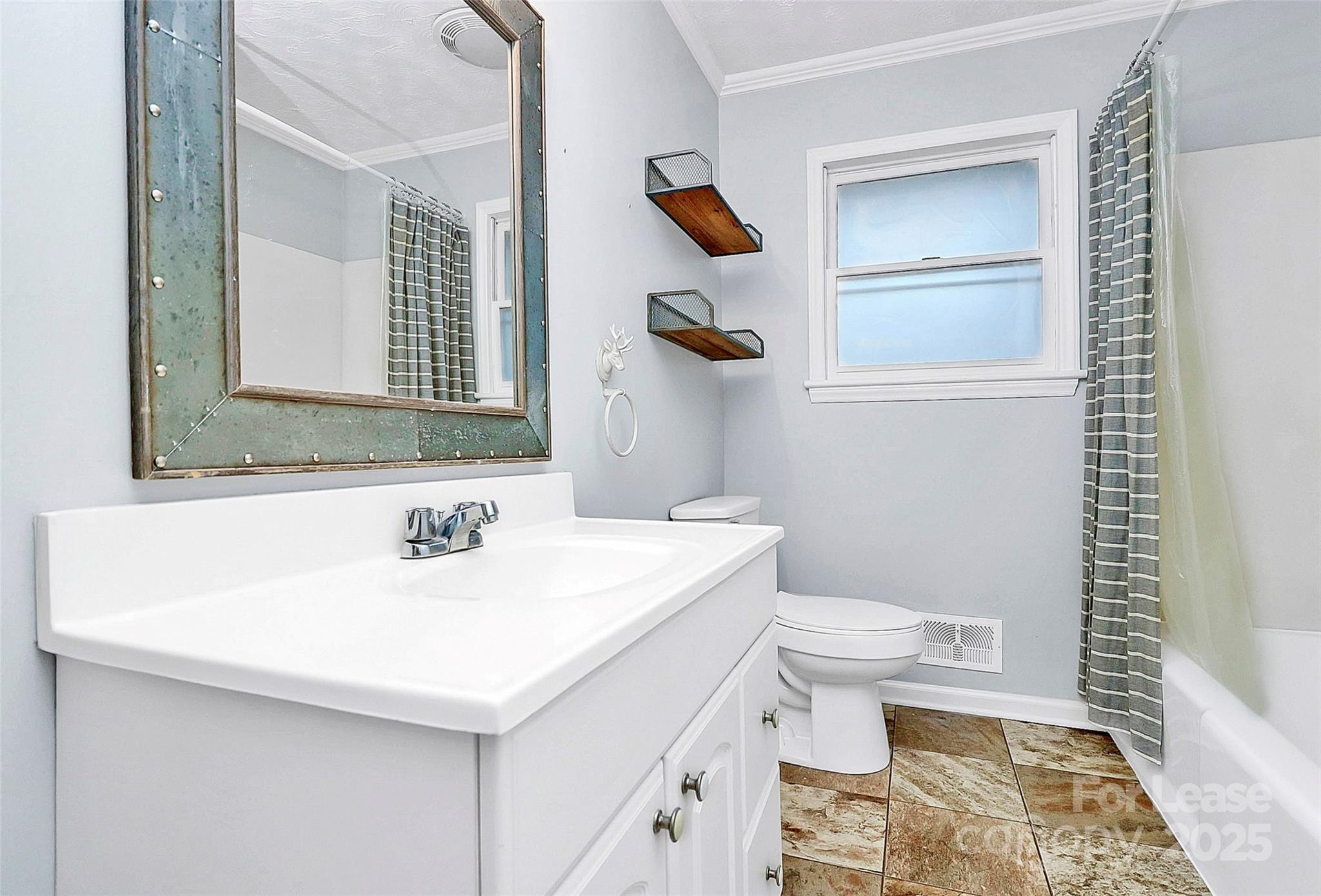 3685 Old Salisbury-Concord Road Concord, NC 28025 - Photo 22 of 33 a bathroom with a sink a toilet and mirror