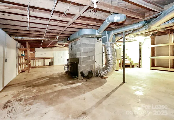 a view of empty room with wooden walls