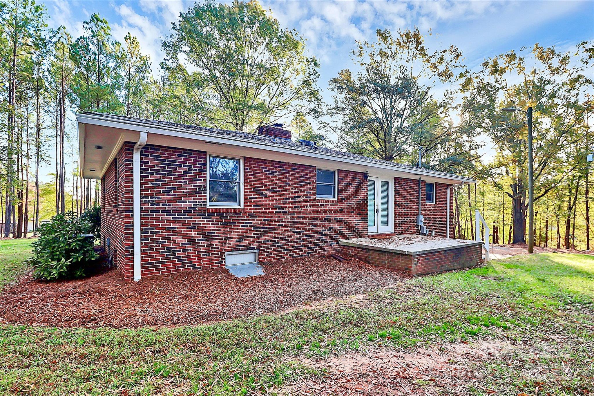 3685 Old Salisbury-Concord Road Concord, NC 28025 - Photo 27 of 33 a front view of a house with garden