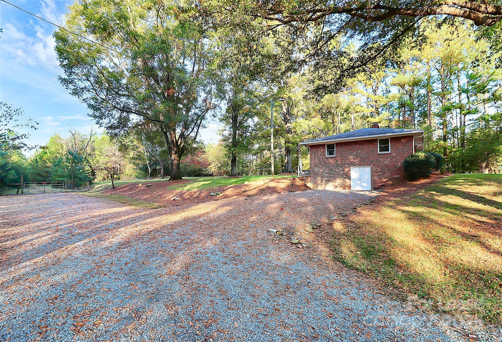 3685 Old Salisbury-Concord Road Concord, NC 28025 - Photo 4 of 33 a view of a house with a yard and tree s