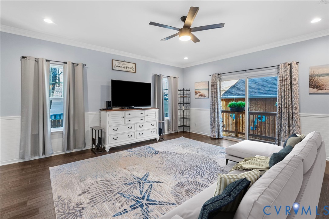 123 8th Street Colonial Beach, VA 22443 - Photo 13 of 36 a bedroom with furniture and a flat screen tv