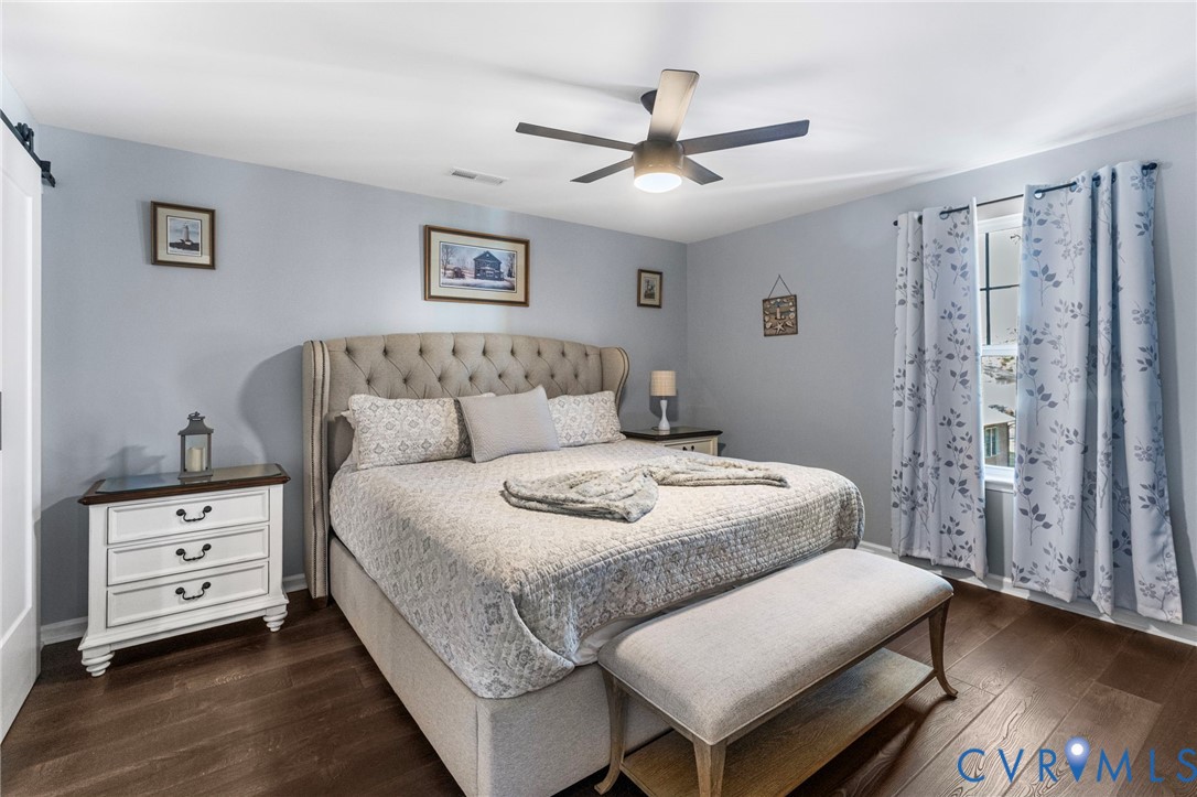 123 8th Street Colonial Beach, VA 22443 - Photo 18 of 36 a bedroom with a bed and a night stand