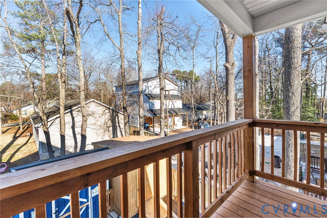 123 8th Street Colonial Beach, VA 22443 - Photo 21 of 36 a view of balcony with wooden floor and fence