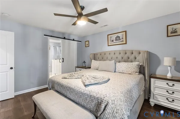 a bedroom with a bed and a table