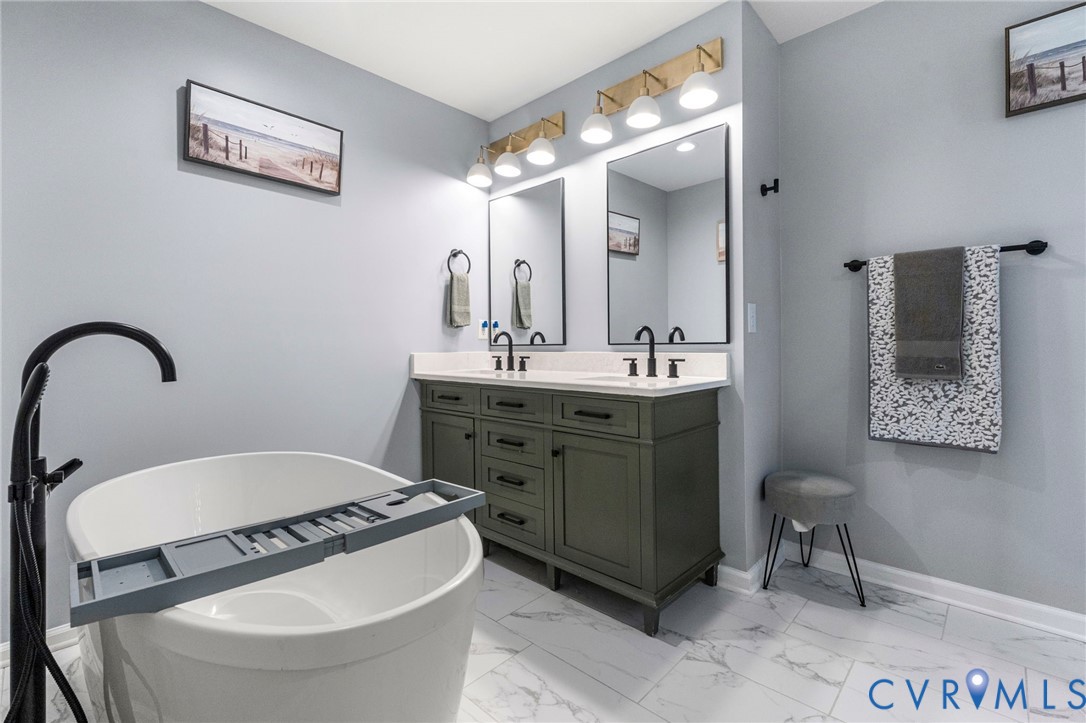 123 8th Street Colonial Beach, VA 22443 - Photo 22 of 36 a bathroom with a sink and a mirror