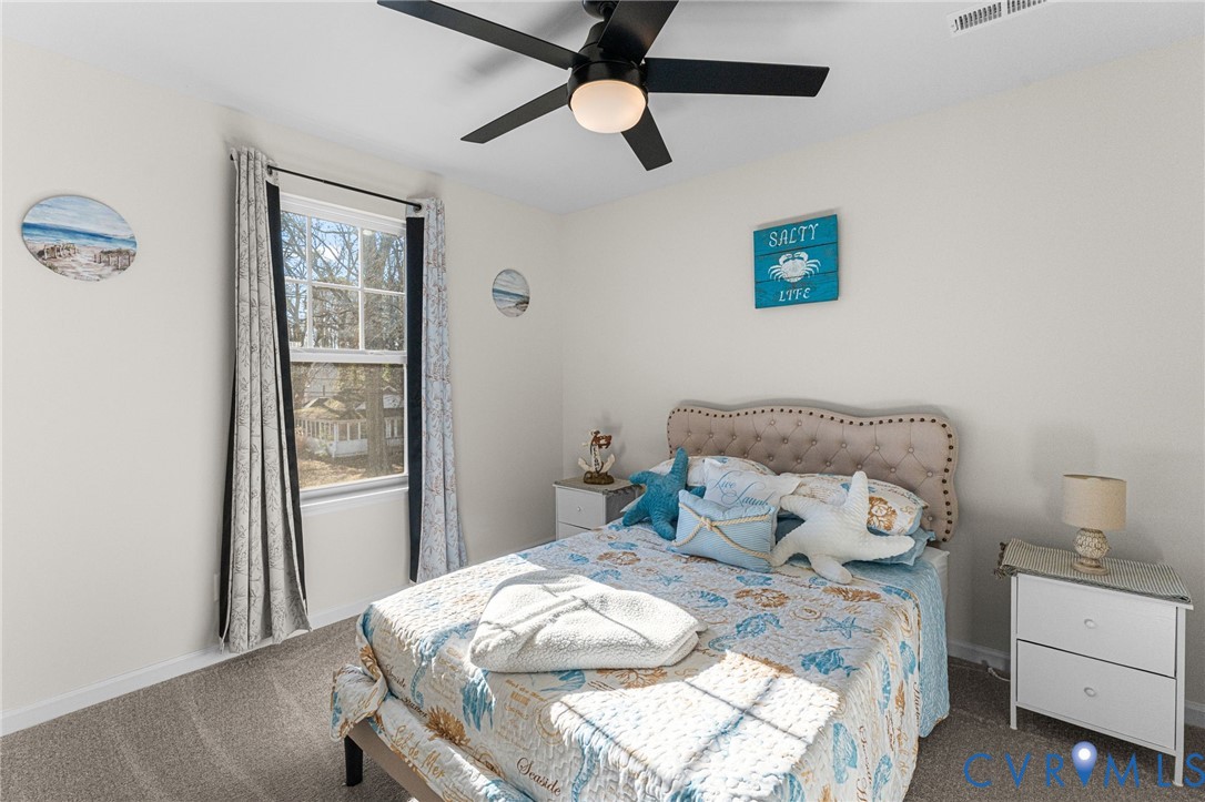 123 8th Street Colonial Beach, VA 22443 - Photo 27 of 40 a bedroom with a bed and a window