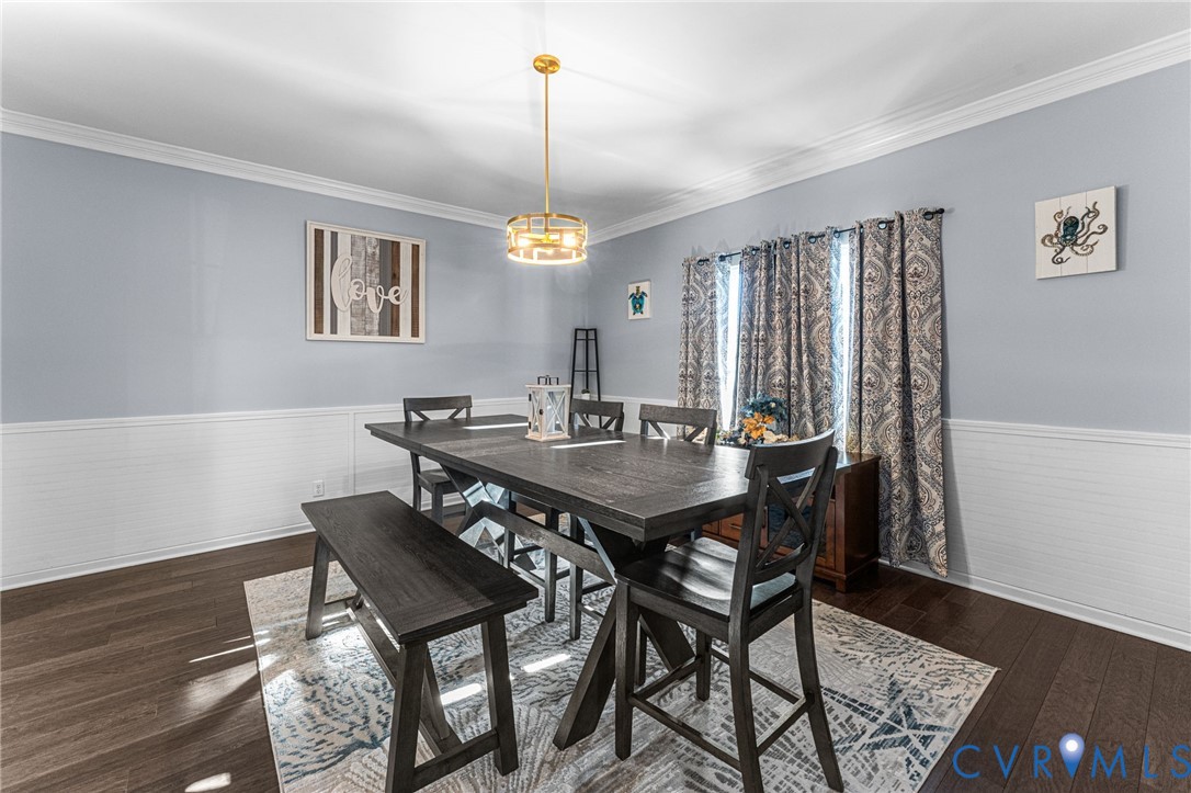 123 8th Street Colonial Beach, VA 22443 - Photo 3 of 40 a view of a dining room with furniture window and wooden floor